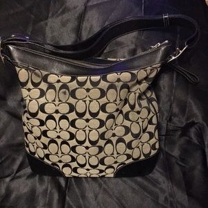 COACH handbag gently used. Black. There are a couple small places of wear.